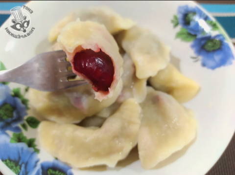 Ukrainian steamed dumplings with cherries