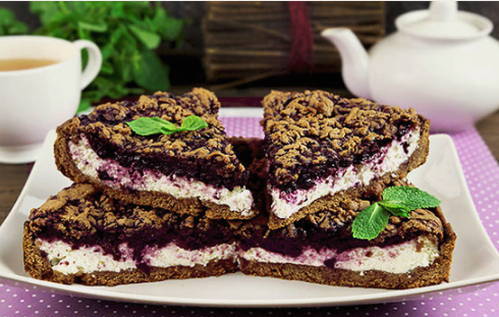 Pie with cottage cheese and blueberries from shortcrust pastry in the oven