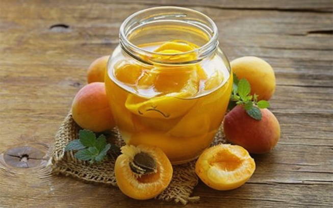 Peach compote without sterilization with a bone for the winter