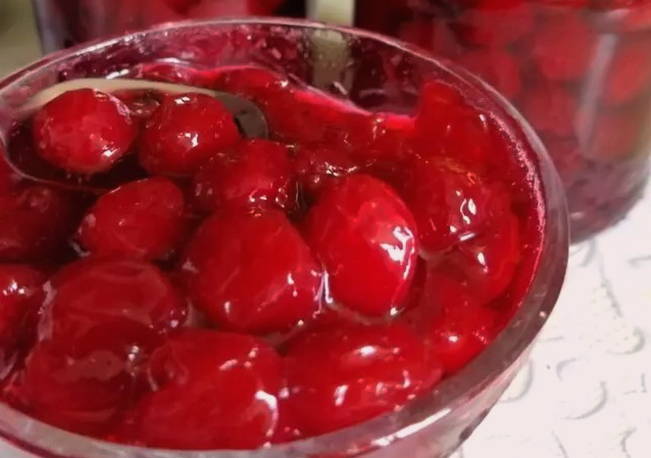 Five-minute cherry jam with seeds in syrup for the winter