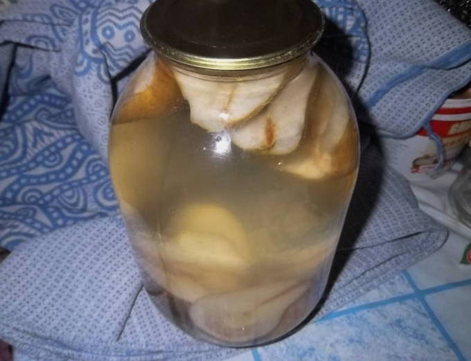 Pear compote with citric acid in a 3 liter jar for the winter