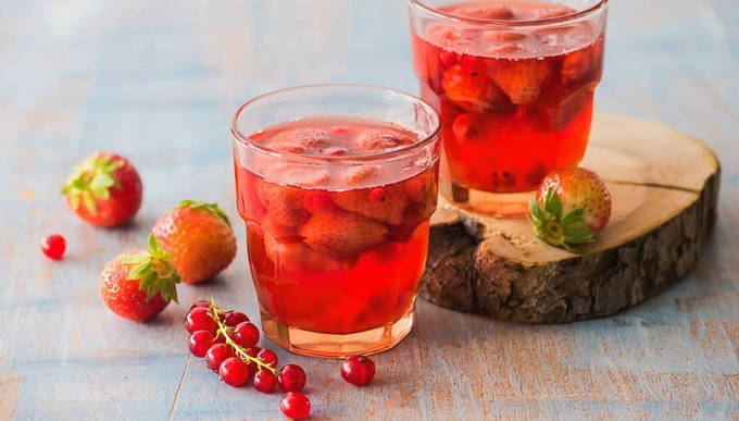 Red currant and strawberry compote in a 3-liter jar for the winter