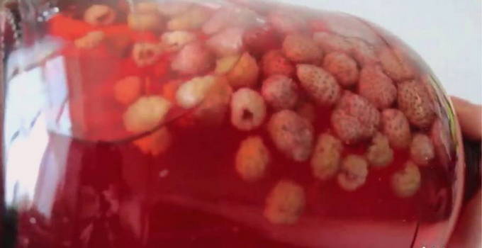 Raspberry and strawberry compote in a 3-liter jar for the winter