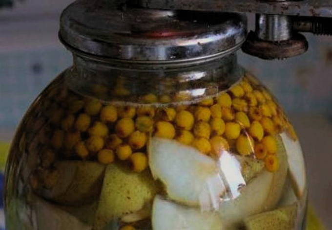 Sea buckthorn and apple compote in a 3-liter jar for the winter