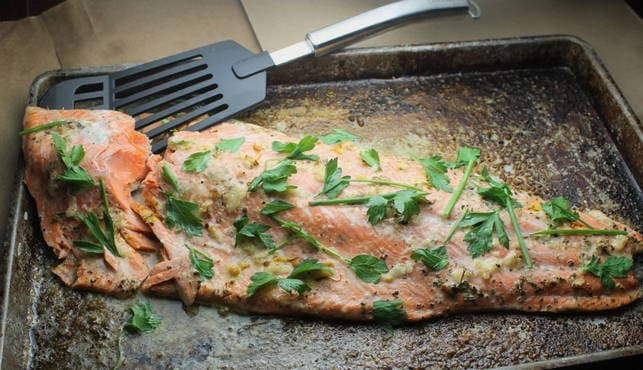 Whole pink salmon in the oven with sour cream