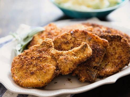 Pork chop in a pan, breaded